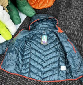 Key Features: Superior Insulation: Filled with 90% premium down, this jacket offers incredible warmth without the bulk, ideal for cold weather conditions. Water-Resistant Shell: The durable outer fabric is treated with a water-repellent coating to keep you dry in light rain and snow. Breathable and Lightweight: Enjoy the perfect balance of warmth and breathability, ensuring comfort during both high-activity outdoor adventures and everyday wear. Eco-Friendly Materials: Crafted with sustainable materials, this jacket is a conscious choice for the environmentally-aware consumer. Versatile Design: Whether you're trekking through the mountains or navigating the city streets, the sleek, minimalistic design of this jacket ensures you'll look as good as you feel. Packable: Easily compress this jacket into a compact size for travel or storage, making it an excellent option for your on-the-go lifestyle.